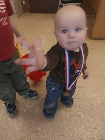 Action shot of the medallion - he'll have the camera, too!