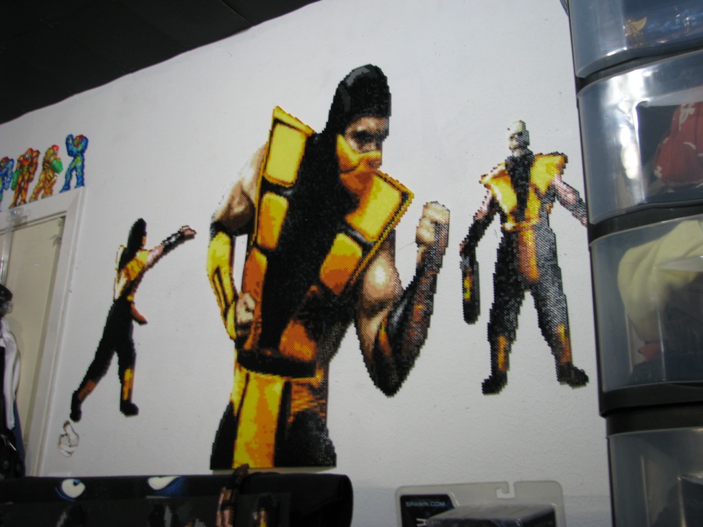 Scorpion Ultimate MKIII &quot;VS&quot; sprite from the Sega Genesis version.  the two others are from the Super Nintendo version of MK.